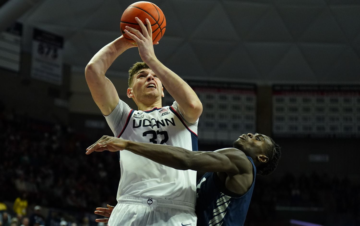 Nov 27, 2023; Storrs, Connecticut, USA; UConn Huskies center Donovan Clingan (32) shoots against New Hampshire Wildcats forward Clarence Daniels (21) in the second half at Harry A. Gampel Pavilion.
